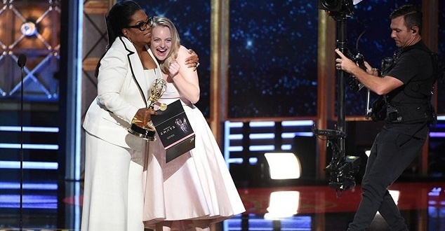 Invision/AP Elisabeth Moss accepts an award at the 2017 Primetime Emmys